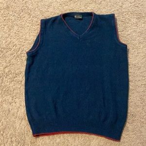 Blue sweater vest with red lining